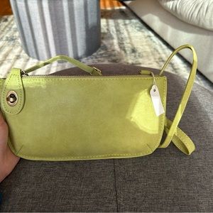 Brand new! Never used small clutch/purse with tags present.